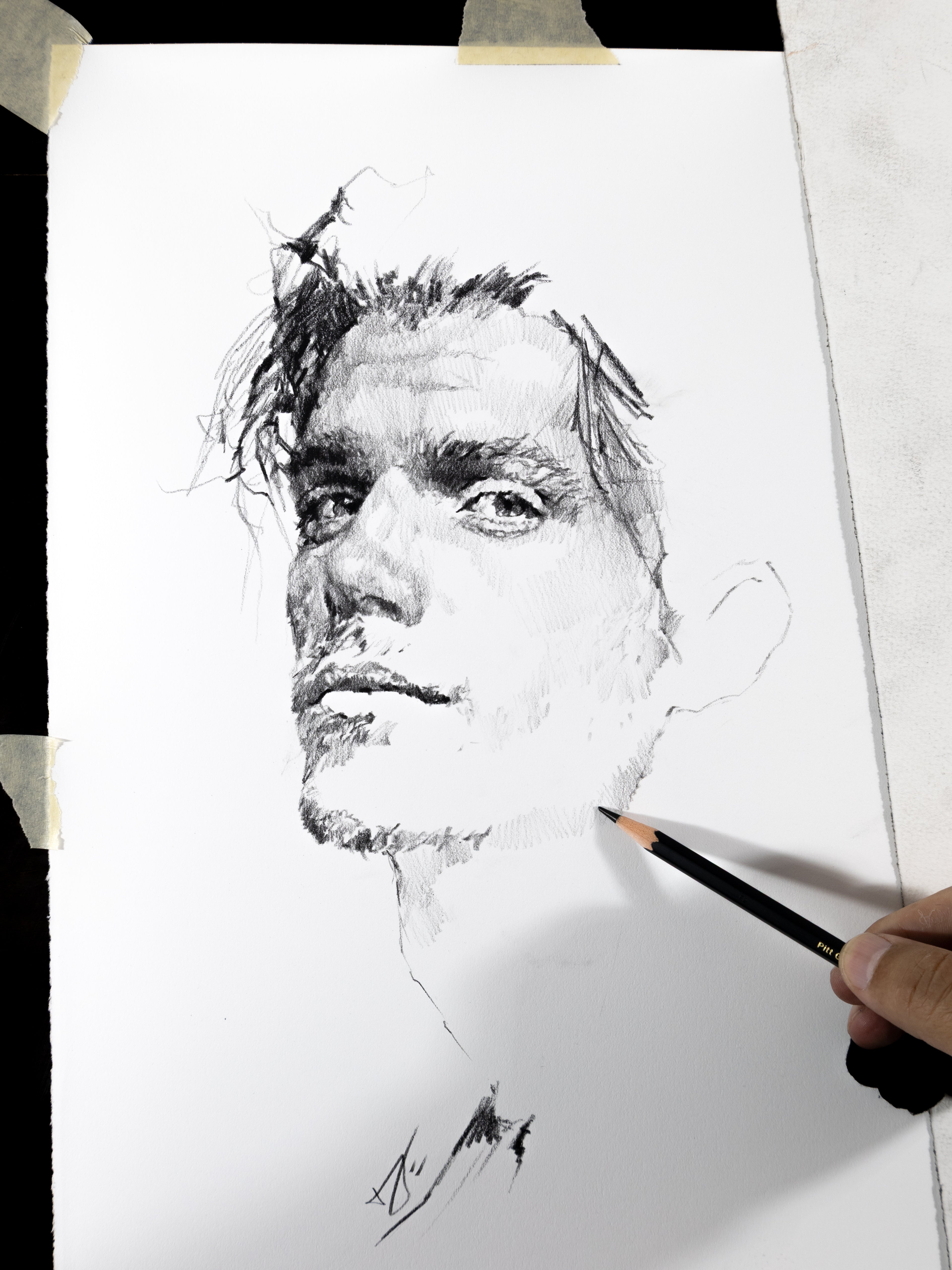 Hand-drawn graphite portrait of a man, original artwork by Houston artist Andros Karr — custom commission.