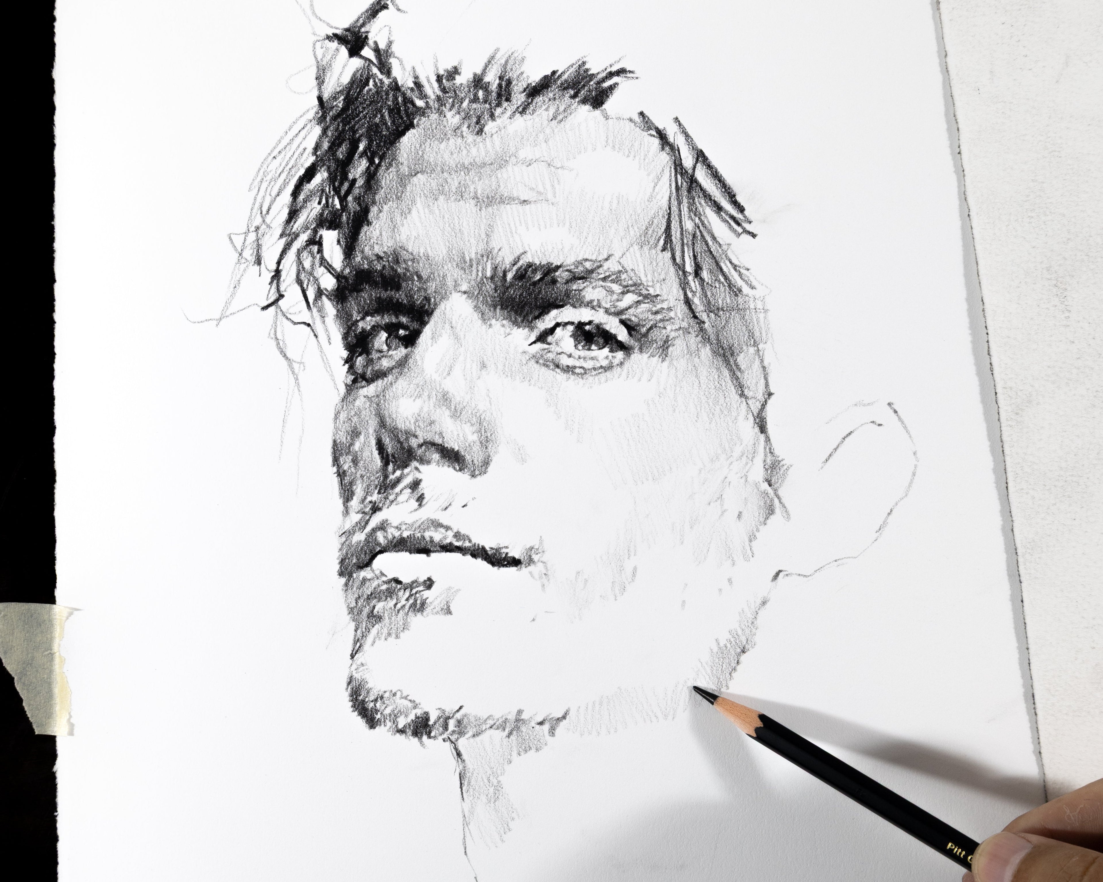 Artist's hand drawing a portrait in progress — every shadow drawn by hand, no blending tools, no AI